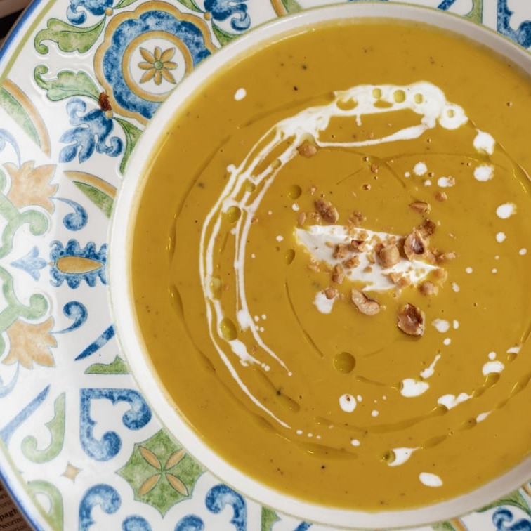 Creamy pumpkin soup with mascarpone and hazelnuts